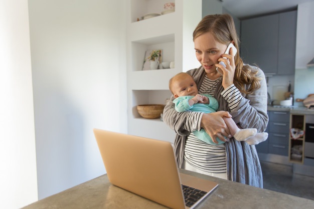 focused new mom holding baby 74855 4225